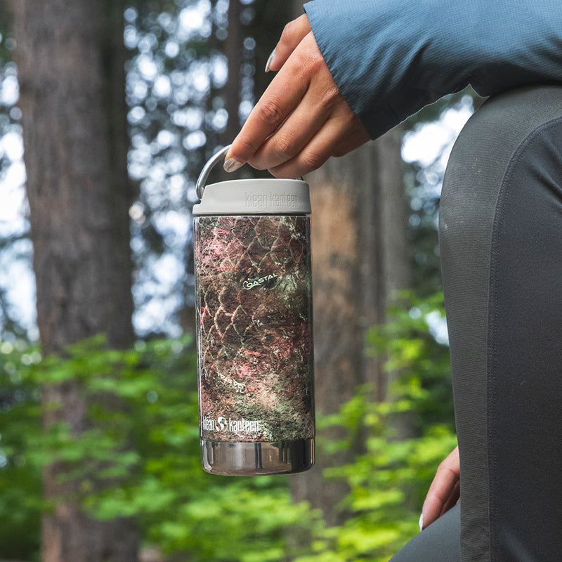 12oz-tkwide-with-twist-cap-mossy-oak-f8 12oz_tumbler_mossyoak_rainbowtrout_hand_closeup_square.jpg