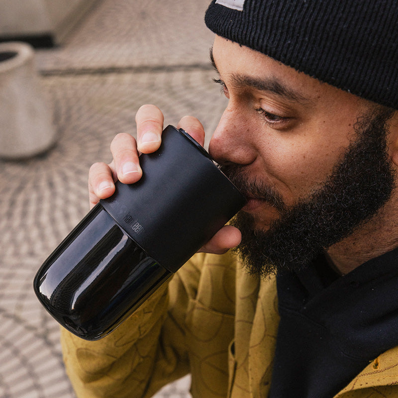 16oz-rise-tumbler-g7 16oz_rise_tumbler_black_man_drink_square.jpg