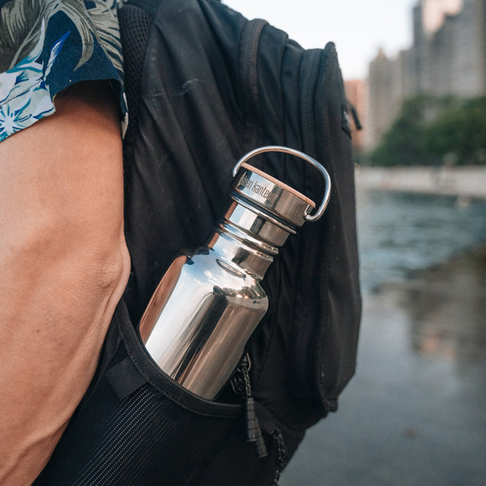 27oz-reflect-with-bamboo-cap-y3 K27SSLRF-MS-BAMBOO_reflect-bottle_backpack_lifestyle.jpg